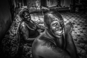 Cuba, Havanna, laughing couple sitting on the sofa, time for a cigarette, Cuba, Havanna, laughing couple sitting on the sofa, time for a cigarette,